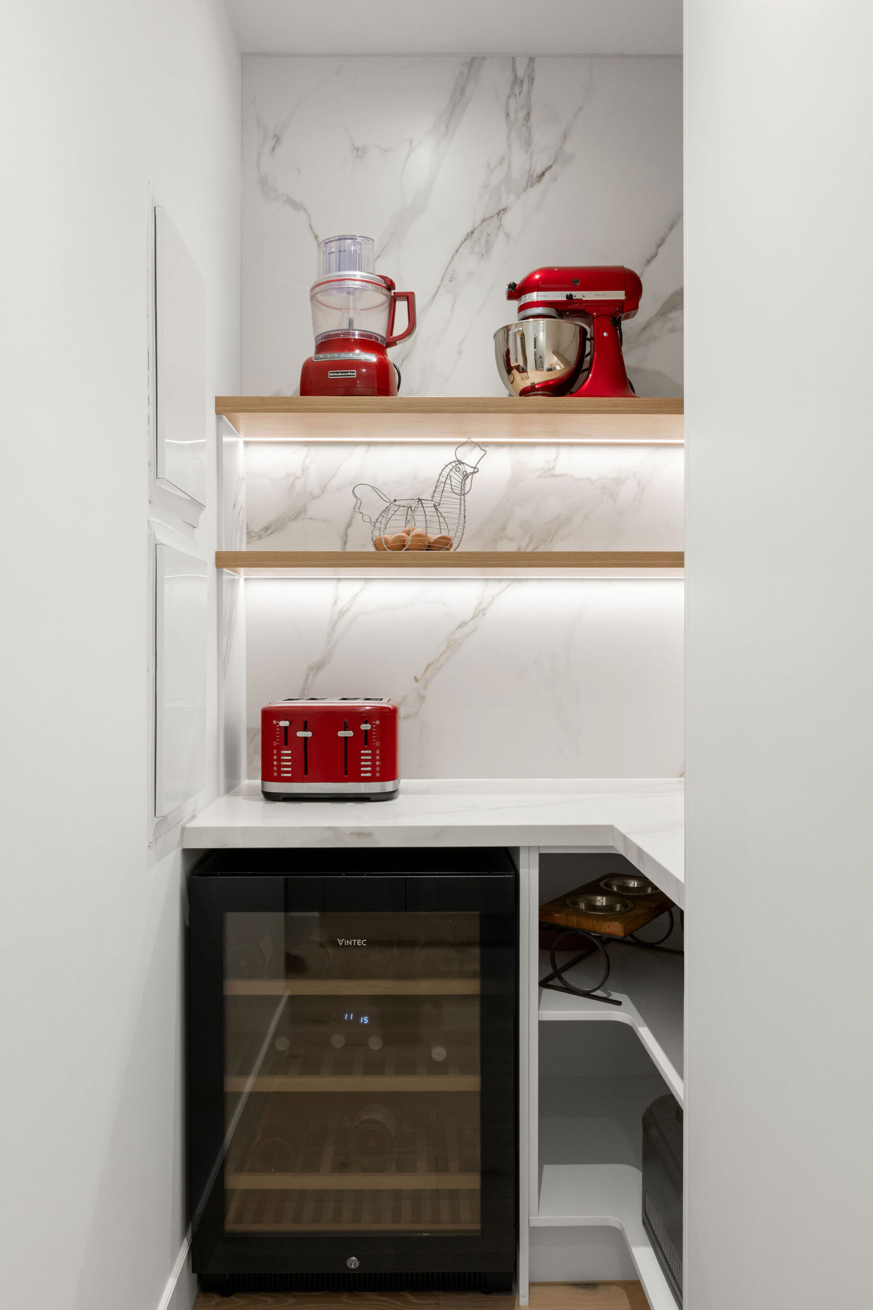 Inside a walk in pantry with a bar fridge