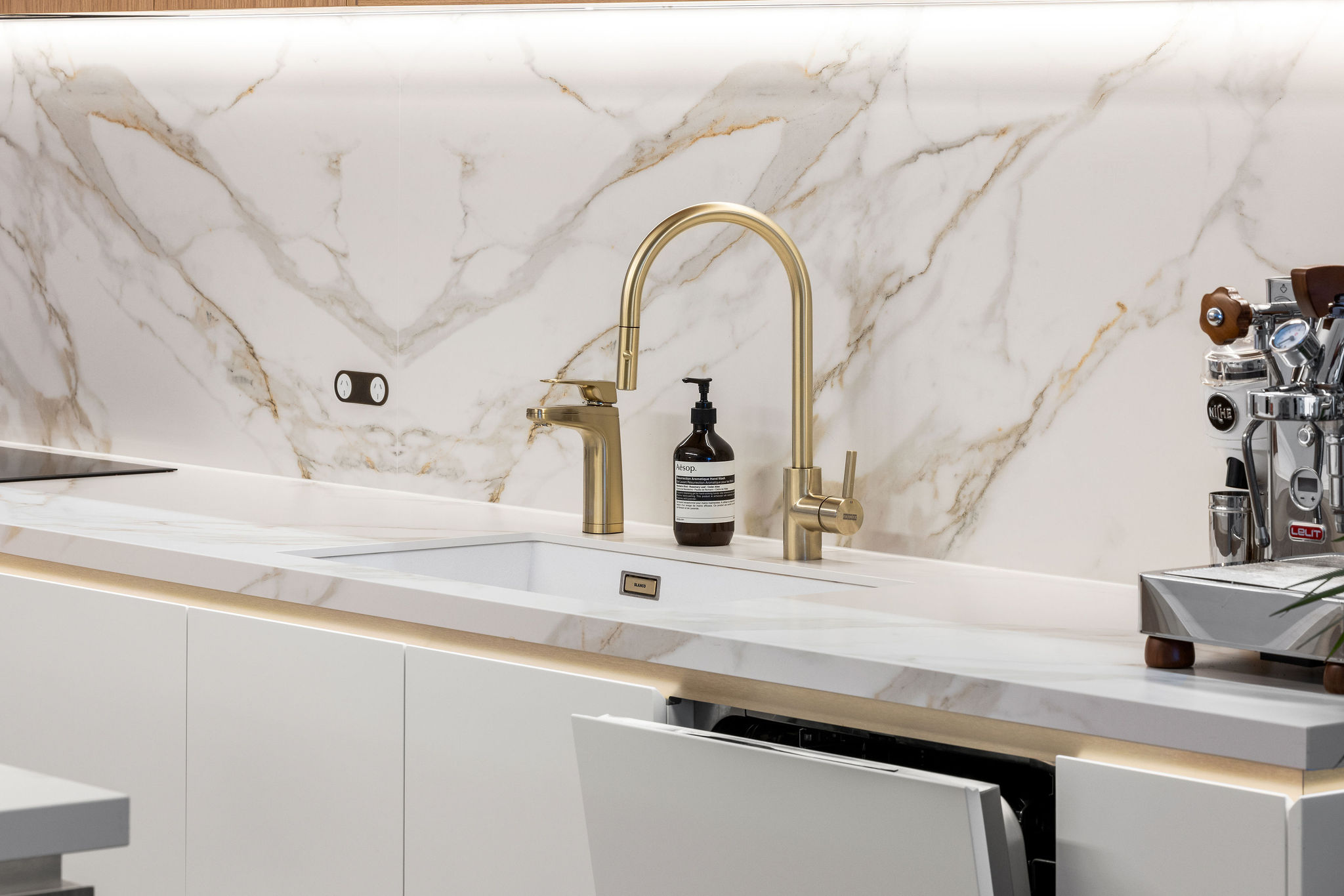 White kitchen with integrated dishwasher